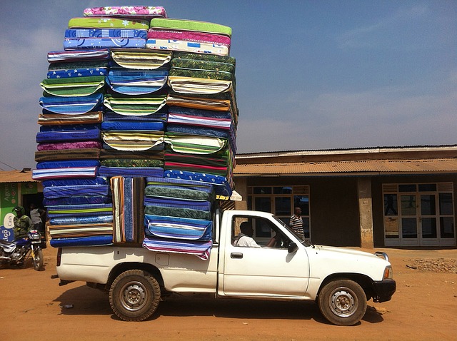 Vehicle carrying piled up mattress